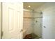 Updated bathroom with a walk-in shower and tiled walls at 1015 Highland Crest Cir, Lake Wales, FL 33853