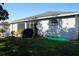 Backyard with patio, grill and kayak at 1015 Highland Crest Cir, Lake Wales, FL 33853