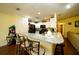 Kitchen with granite island and breakfast bar seating at 1015 Highland Crest Cir, Lake Wales, FL 33853