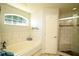 Spa-like bathroom with soaking tub, walk-in shower and tile flooring at 1015 Highland Crest Cir, Lake Wales, FL 33853