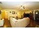 Bright living room with large sectional sofa and wood flooring at 1015 Highland Crest Cir, Lake Wales, FL 33853