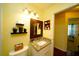 Charming bathroom with granite countertop and decorative mirror at 1015 Highland Crest Cir, Lake Wales, FL 33853