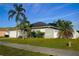 House exterior with a two-car garage and well-manicured lawn at 1015 Highland Crest Cir, Lake Wales, FL 33853