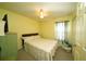 Bright bedroom with a queen-size bed and ceiling fan at 1015 Highland Crest Cir, Lake Wales, FL 33853