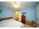 Spacious bedroom with ceiling fan and view into another room at 1015 Highland Crest Cir, Lake Wales, FL 33853