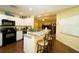 Modern kitchen with black appliances and granite counters at 1015 Highland Crest Cir, Lake Wales, FL 33853