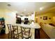 Kitchen with granite island and breakfast bar seating at 1015 Highland Crest Cir, Lake Wales, FL 33853