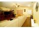 Open living room with sectional sofa and view to kitchen at 1015 Highland Crest Cir, Lake Wales, FL 33853
