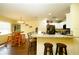Kitchen with granite countertops and breakfast bar at 1015 Highland Crest Cir, Lake Wales, FL 33853