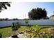 Landscaped backyard with a patio and privacy fence at 1015 Highland Crest Cir, Lake Wales, FL 33853