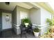 Inviting front porch with seating area and potted plants at 1015 Highland Crest Cir, Lake Wales, FL 33853