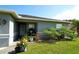 Front entrance of the house with porch and potted plants at 1015 Highland Crest Cir, Lake Wales, FL 33853
