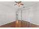 Spacious bedroom with wood flooring and access to a hallway at 4904 Goldenview Ln, Lakeland, FL 33811