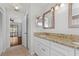 Double vanity bathroom with granite countertops and white cabinets at 4904 Goldenview Ln, Lakeland, FL 33811