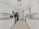 Updated kitchen boasts white cabinets and granite countertops at 4904 Goldenview Ln, Lakeland, FL 33811
