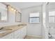 Double vanity bathroom with granite countertops and white cabinets at 4904 Goldenview Ln, Lakeland, FL 33811