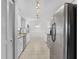 Bright kitchen with white cabinets, granite counters, and stainless appliances at 4904 Goldenview Ln, Lakeland, FL 33811