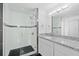 Modern bathroom with granite countertops and a large walk-in shower at 1710 Garden Lake Dr # 1710, Winter Haven, FL 33884
