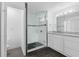 Modern bathroom with granite countertops and a large walk-in shower at 1710 Garden Lake Dr # 1710, Winter Haven, FL 33884