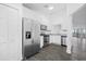 Modern kitchen with stainless steel appliances and granite countertops at 1710 Garden Lake Dr # 1710, Winter Haven, FL 33884