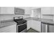 Modern kitchen with stainless steel appliances and granite countertops at 1710 Garden Lake Dr # 1710, Winter Haven, FL 33884