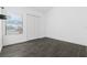 Simple bedroom with dark grey tile flooring and a large closet at 1710 Garden Lake Dr # 1710, Winter Haven, FL 33884
