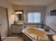 Relax in this updated bathroom, featuring a soaking tub and updated vanity at 1744 Quail Hill Dr, Lakeland, FL 33810