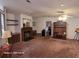 Spacious living room with a fireplace and built-in shelving at 1744 Quail Hill Dr, Lakeland, FL 33810