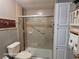 Updated bathroom with a walk-in shower and storage at 1744 Quail Hill Dr, Lakeland, FL 33810