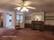 Bright living room with fireplace, built-in shelving, and a view of the kitchen at 1744 Quail Hill Dr, Lakeland, FL 33810
