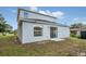Two-story house with backyard and sliding glass door at 258 Padgett Pl S, Lakeland, FL 33809