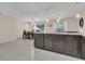 Open kitchen with island and granite countertops at 258 Padgett Pl S, Lakeland, FL 33809