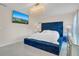 Main bedroom with a large TV and a comfortable bed at 258 Padgett Pl S, Lakeland, FL 33809