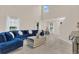 Open living room with high ceilings and large windows at 258 Padgett Pl S, Lakeland, FL 33809