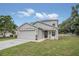 Two-story house with gray siding and stone accents at 258 Padgett Pl S, Lakeland, FL 33809