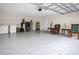 Large garage with ample storage and tiled floor at 258 Padgett Pl S, Lakeland, FL 33809