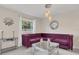 Living room featuring a plush purple sectional sofa at 258 Padgett Pl S, Lakeland, FL 33809