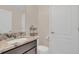 Modern bathroom with granite countertop and updated toilet at 258 Padgett Pl S, Lakeland, FL 33809