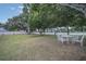 Private backyard with seating area and mature trees at 258 Padgett Pl S, Lakeland, FL 33809