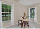 Cozy breakfast nook with glass table and two stools at 258 Padgett Pl S, Lakeland, FL 33809