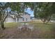 Peaceful backyard with a patio set under the shade of trees at 258 Padgett Pl S, Lakeland, FL 33809