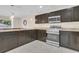 Modern kitchen with stainless steel appliances and granite counters at 258 Padgett Pl S, Lakeland, FL 33809