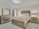 Guest bedroom with a neutral-toned bed and matching dresser at 258 Padgett Pl S, Lakeland, FL 33809