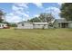 House backyard with grassy area and chain link fence at 218 King Rd, Winter Haven, FL 33880