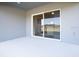 Covered patio with sliding glass doors leading to the backyard at 559 Sw 77Th Cir, Ocala, FL 34474