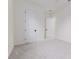 Simple bedroom with neutral decor and carpet flooring at 1001 Cody Bluffs Rd, Babson Park, FL 33827