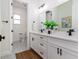 Double vanity bathroom with modern finishes and grey tile at 1001 Cody Bluffs Rd, Babson Park, FL 33827