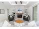 Relaxing living room with a stone fireplace and built-in shelving at 1001 Cody Bluffs Rd, Babson Park, FL 33827