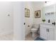 Stylish powder room with white cabinets and a modern toilet at 1001 Cody Bluffs Rd, Babson Park, FL 33827