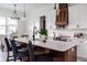 Modern kitchen with white shaker cabinets, quartz countertops, and a large island at 1001 Cody Bluffs Rd, Babson Park, FL 33827
